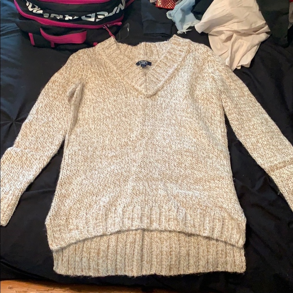 white, tan and gold sweater